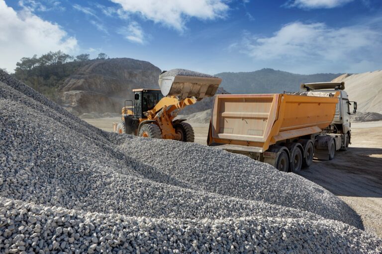 Wheel,Loader,Loads,A,Truck,With,Sand,In,A,Gravel