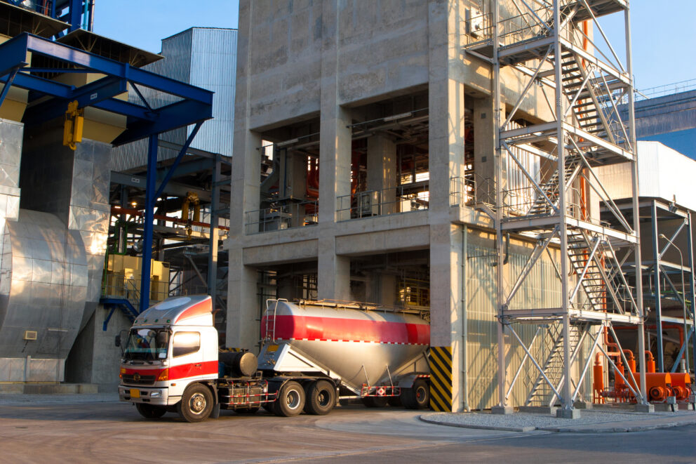 Truck at silo loading in bulk material plant